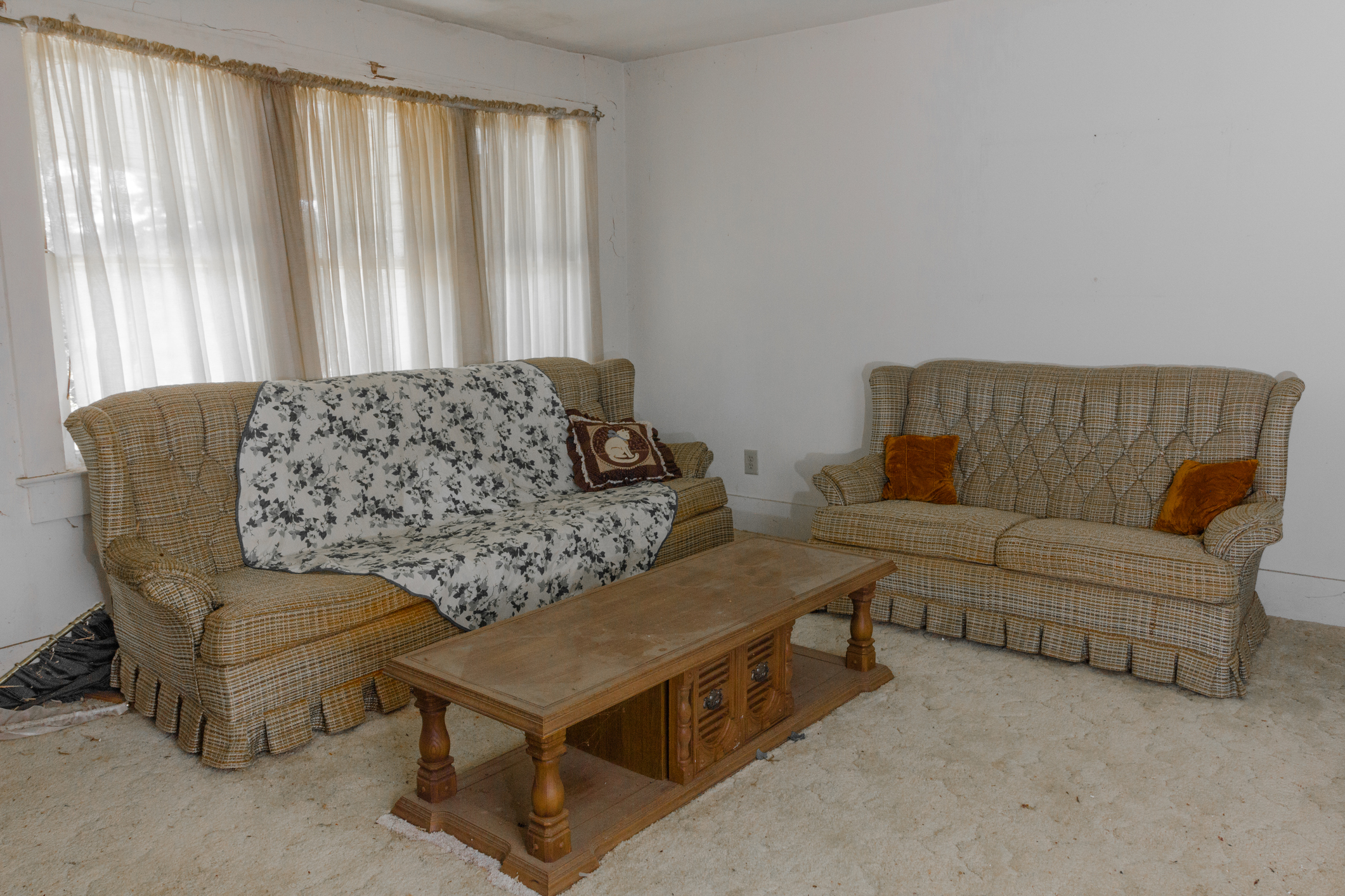 Vintage couches and coffee table left forgotten in an abandoned house deceased estate clear outs the junk men